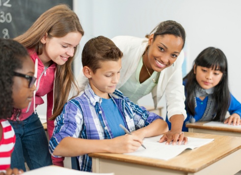 Teacher and students working together